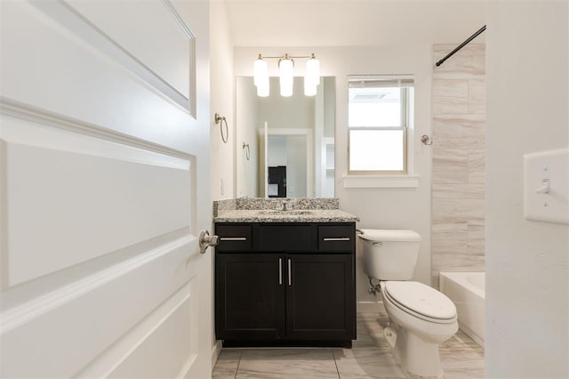 bathroom with toilet, vanity, and shower / bathing tub combination