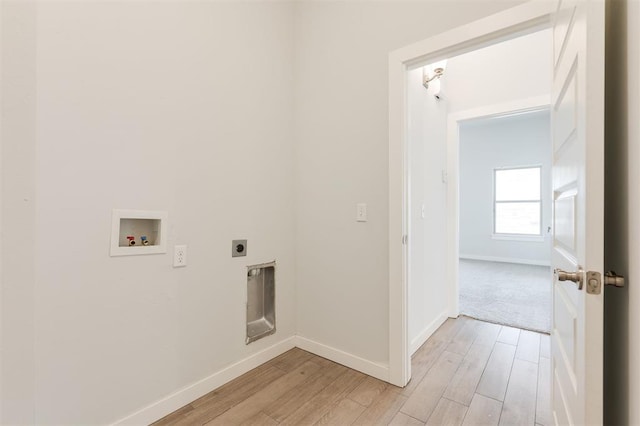 washroom featuring light wood-style floors, hookup for an electric dryer, washer hookup, and laundry area