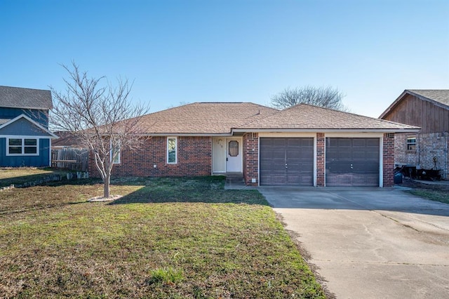 ranch-style home featuring brick siding, a front lawn, concrete driveway, and a garage