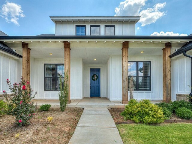 114 Alamosa Rd, Norman, OK 73069 - property entrance featuring board and batten siding and a porch