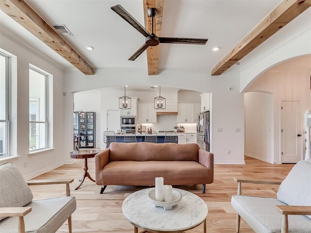114 Alamosa Rd, Norman, OK 73069 - living area featuring beam ceiling, baseboards, recessed lighting, light wood-type flooring, and arched walkways