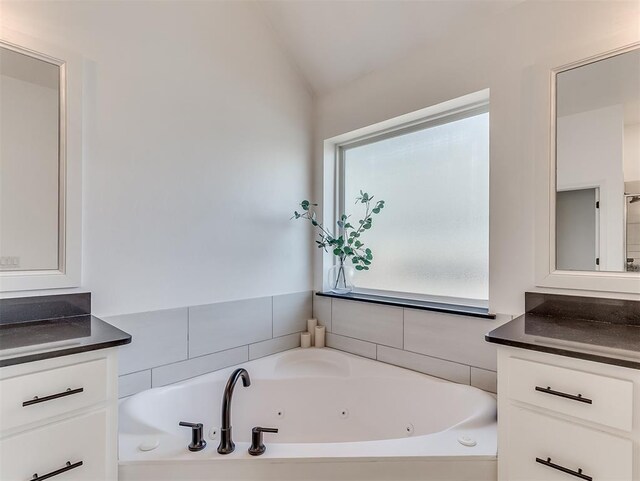 114 Alamosa Rd, Norman, OK 73069 - full bath with vanity, a jetted tub, and vaulted ceiling