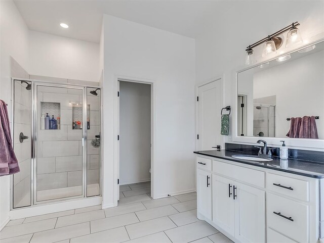 114 Alamosa Rd, Norman, OK 73069 - full bathroom featuring a stall shower, vanity, tile patterned flooring, and baseboards