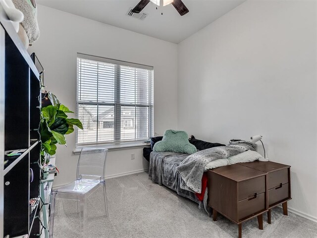 114 Alamosa Rd, Norman, OK 73069 - bedroom with multiple windows, carpet floors, baseboards, and a ceiling fan