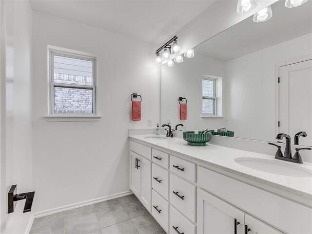 114 Alamosa Rd, Norman, OK 73069 - full bath featuring double vanity and baseboards
