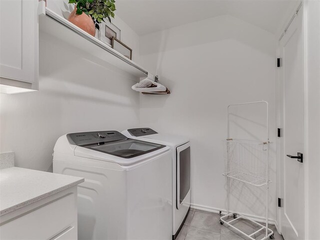 114 Alamosa Rd, Norman, OK 73069 - laundry room with separate washer and dryer, cabinet space, and light tile patterned floors