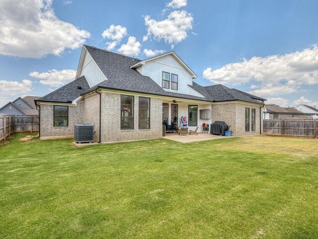114 Alamosa Rd, Norman, OK 73069 - rear view of property with a patio area, a shingled roof, brick siding, a ceiling fan, and central AC