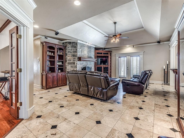 living room featuring ceiling fan, lofted ceiling, a stone fireplace, and ornamental molding