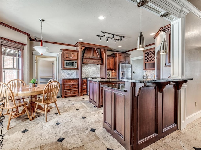 kitchen featuring decorative backsplash, a peninsula, custom range hood, and stainless steel appliances