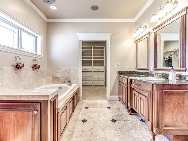 full bath with a spacious closet, vanity, crown molding, and a bath