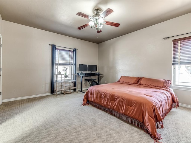 bedroom featuring carpet flooring, a ceiling fan, and baseboards