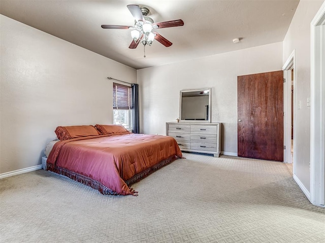 bedroom featuring carpet flooring, baseboards, and ceiling fan