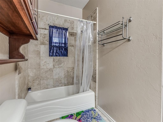 full bath with shower / bath combination with curtain, toilet, and a textured wall