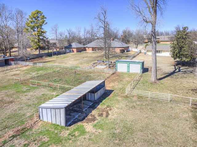 view of yard with an outdoor structure and fence