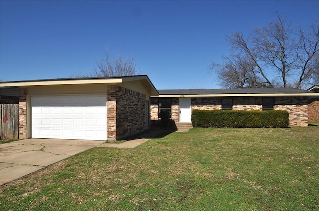 view of front of home featuring a garage, brick siding, concrete driveway, and a front lawn