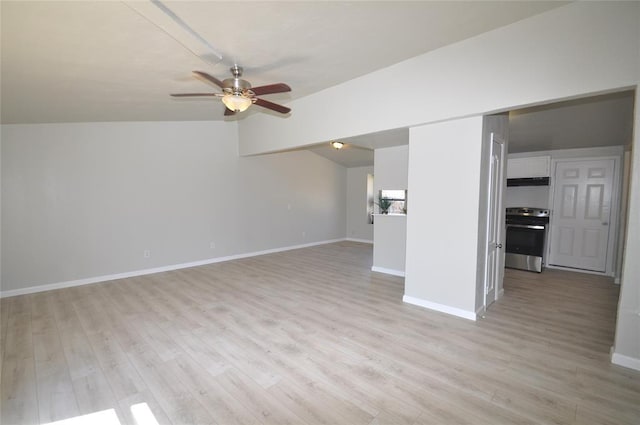 2121 Memphis Dr, Norman, OK 73071 - unfurnished living room featuring ceiling fan, baseboards, light wood-type flooring, and lofted ceiling