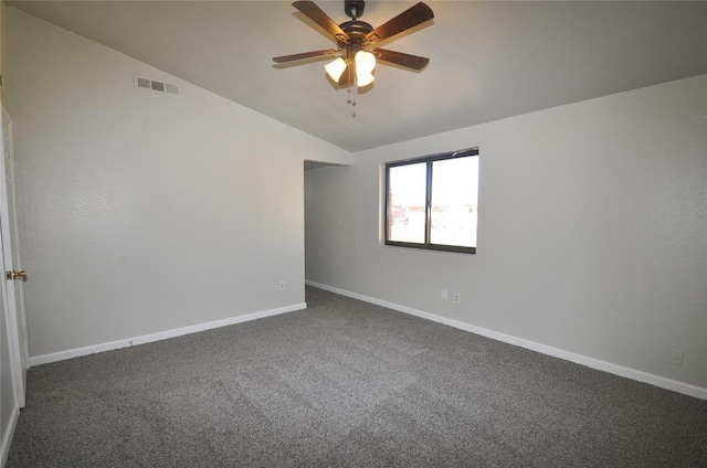 2121 Memphis Dr, Norman, OK 73071 - empty room with baseboards, visible vents, ceiling fan, vaulted ceiling, and carpet flooring
