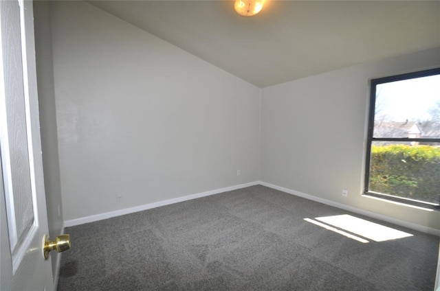 2121 Memphis Dr, Norman, OK 73071 - unfurnished room with vaulted ceiling, baseboards, and dark colored carpet