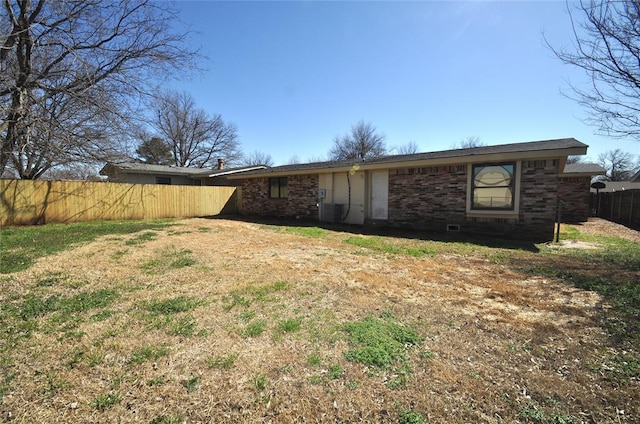 2121 Memphis Dr, Norman, OK 73071 - back of property with brick siding and fence