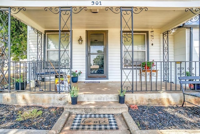 doorway to property featuring a porch