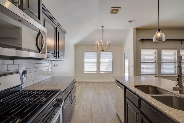 kitchen featuring visible vents, a healthy amount of sunlight, appliances with stainless steel finishes, and a sink