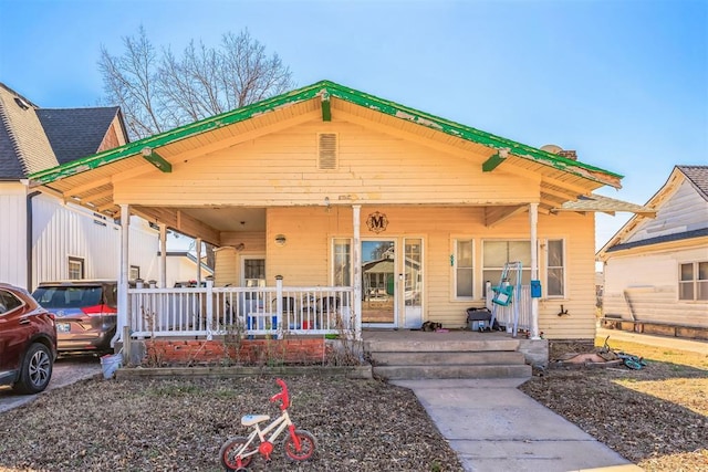 view of front of property featuring covered porch