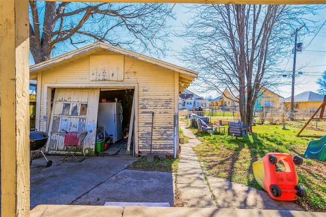 view of outbuilding with an outbuilding and fence