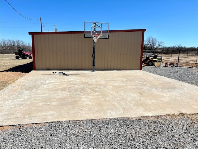 view of sport court with fence