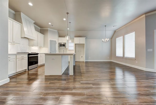 kitchen featuring appliances with stainless steel finishes, a chandelier, dark wood finished floors, and white cabinets