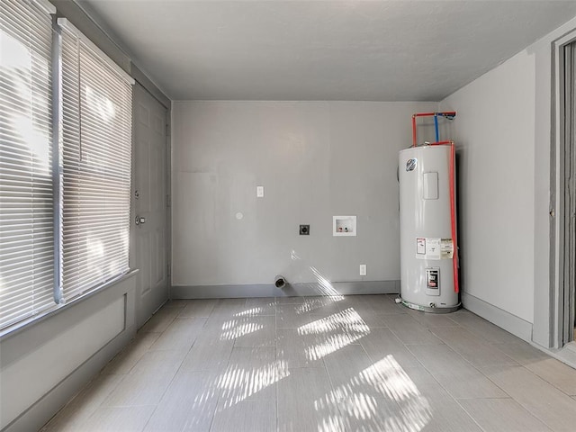 clothes washing area featuring hookup for a washing machine, light tile patterned floors, hookup for an electric dryer, laundry area, and electric water heater