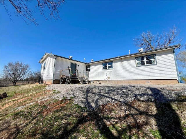 back of house with crawl space