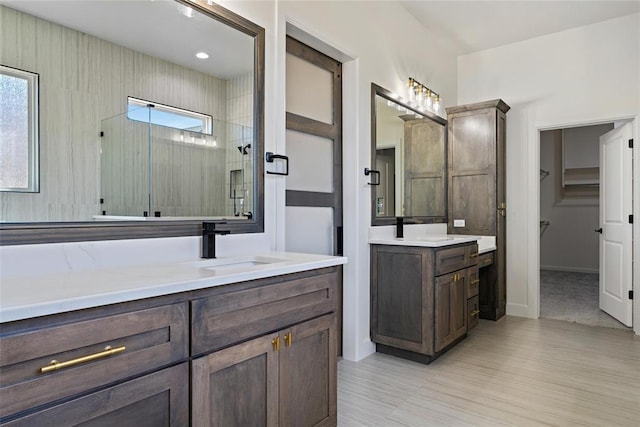 full bath with vanity and a stall shower