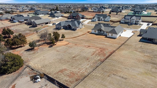 birds eye view of property with a residential view