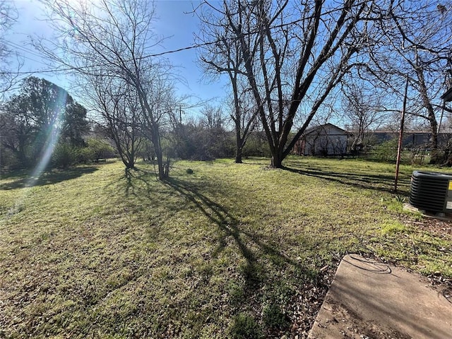 view of yard featuring central AC