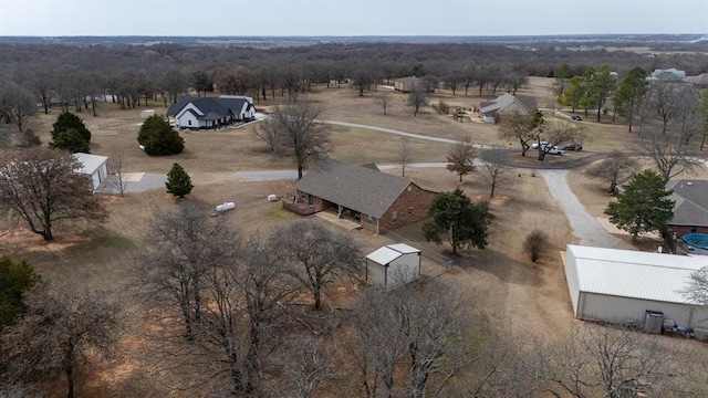 birds eye view of property featuring a rural view