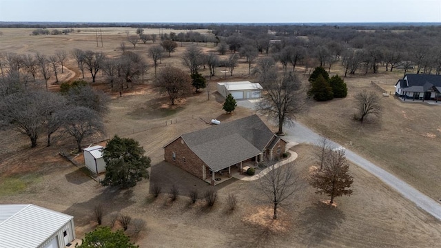 birds eye view of property with a rural view