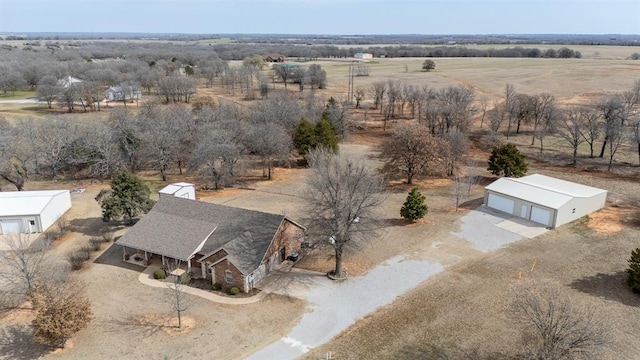 birds eye view of property with a rural view