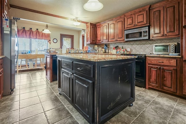 12611 N County Road 3232nd Rd, Paoli, OK 73074 - kitchen with dark cabinetry, a toaster, hanging light fixtures, appliances with stainless steel finishes, and tasteful backsplash