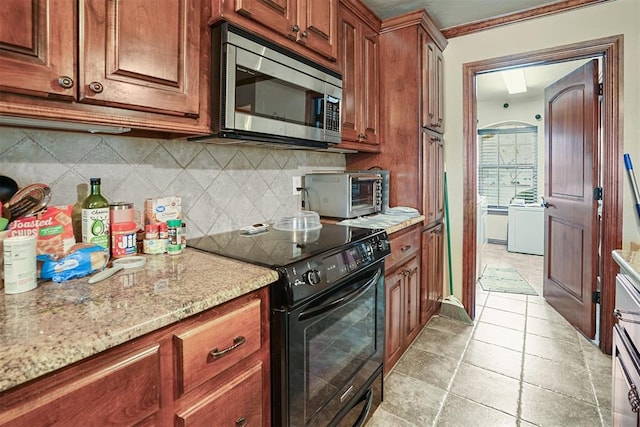 12611 N County Road 3232nd Rd, Paoli, OK 73074 - kitchen with light stone countertops, electric range, a toaster, decorative backsplash, and stainless steel microwave