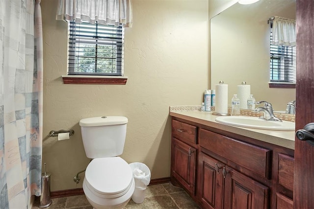 12611 N County Road 3232nd Rd, Paoli, OK 73074 - bathroom with baseboards, toilet, vanity, and a textured wall