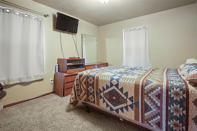 12611 N County Road 3232nd Rd, Paoli, OK 73074 - carpeted bedroom with baseboards and a textured ceiling