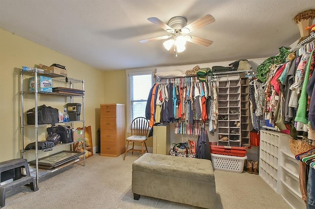 spacious closet with carpet and ceiling fan