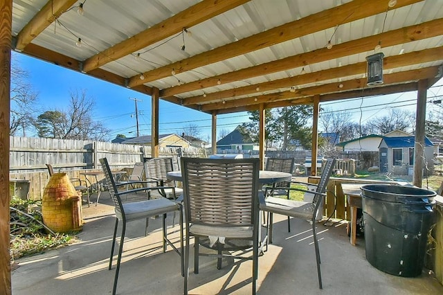 view of patio / terrace with outdoor dining space and fence