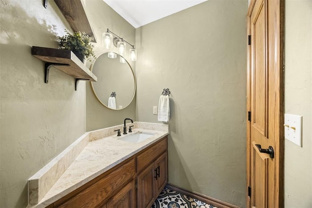 bathroom with vanity and baseboards