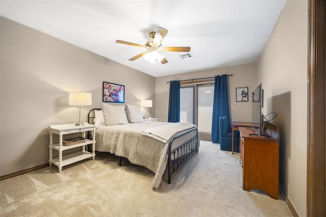 bedroom featuring visible vents, baseboards, light colored carpet, and a ceiling fan