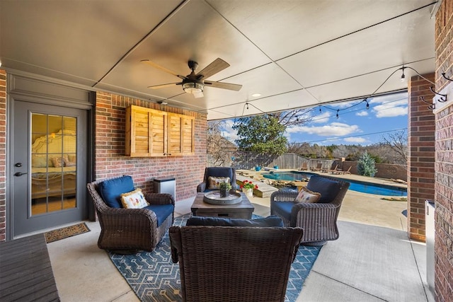 view of patio / terrace featuring an outdoor living space, ceiling fan, a fenced backyard, and a fenced in pool