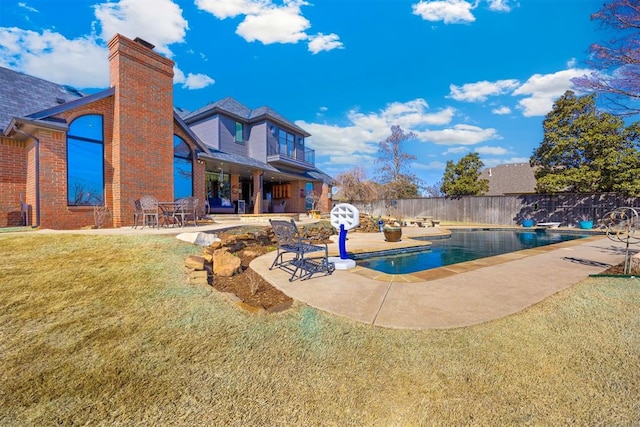 view of swimming pool featuring a fenced in pool, a lawn, a patio, and fence