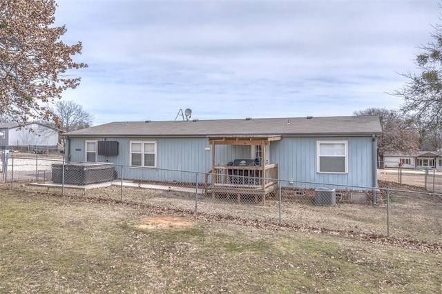 rear view of property with a yard, fence private yard, and crawl space