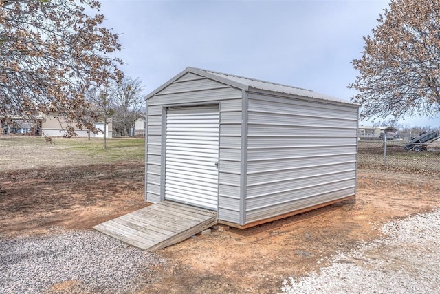 view of shed with fence