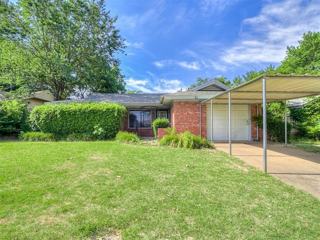 view of front of house with brick siding, a front yard, a garage, a carport, and driveway